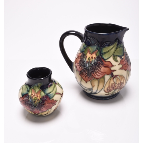 185 - A contemporary Moorcroft jug and vase in the 'Anna Lily' pattern, printed and painted marks, 8cm and... 