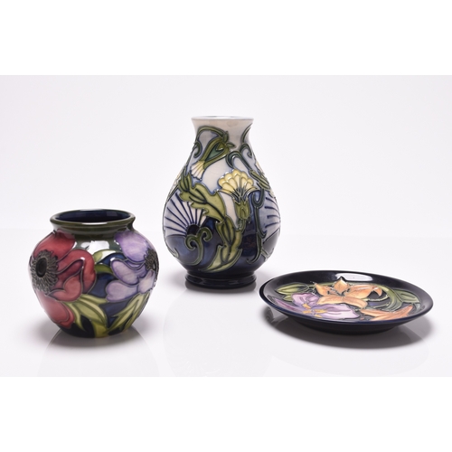 186 - Three pieces of contemporary Moorcroft pottery, comprising a 'Rough Hawskbeard' vase, 14cm high; an ... 