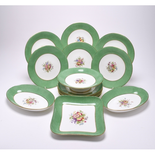 188 - A Wedgwood bone china dessert service, mid-20th century, pattern W2010, centrally painted with fruit... 