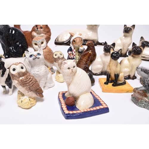 189 - A group of Beswick and Royal Doulton models of cats, including two Royal Doulton 'Cat Collection' mo... 