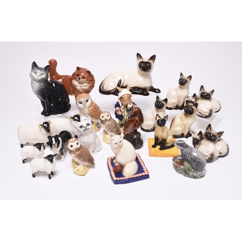 189 - A group of Beswick and Royal Doulton models of cats, including two Royal Doulton 'Cat Collection' mo... 