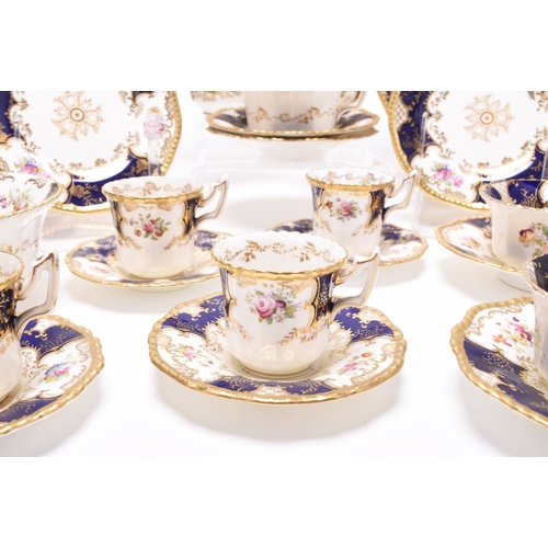 21 - A Coalport blue batwing service, early 20th century, comprising eighteen teacups, eighteen saucers, ... 