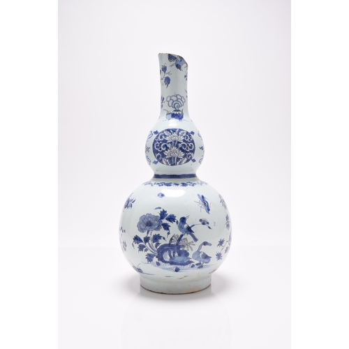 212 - A German faience double gourd vase, late 17th century, German painted in the Chinese-style with a bi... 