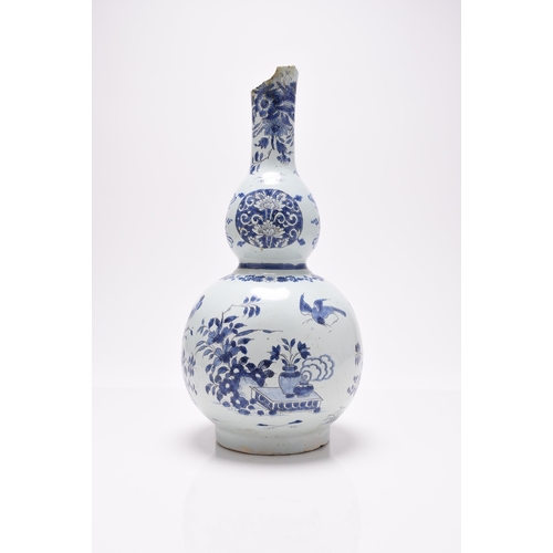 212 - A German faience double gourd vase, late 17th century, German painted in the Chinese-style with a bi... 