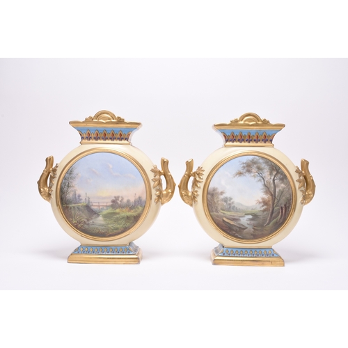 216 - A pair of French porcelain moon flask vases, late 19th century, of twin-handled form, nicely decorat... 