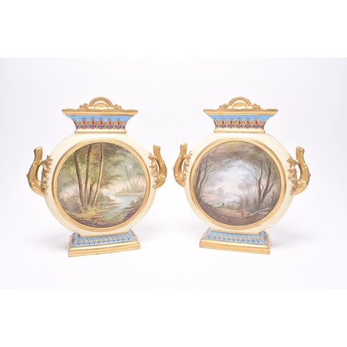 216 - A pair of French porcelain moon flask vases, late 19th century, of twin-handled form, nicely decorat... 