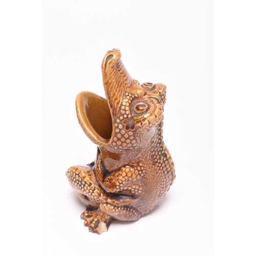 24 - A Burmantofts faience grotesque spoon warmer in the form of a crocodile, late 19th century, brown gl... 