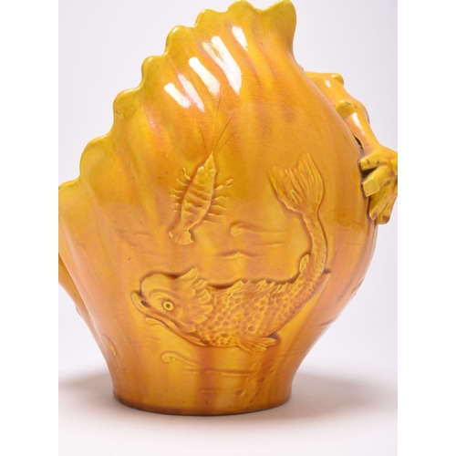 31 - An unusual Burmantofts faience vase or basket, late 19th century, of single-handled form,. yellow or... 