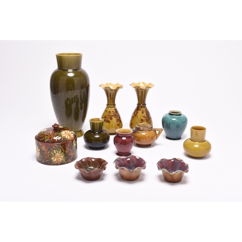 33 - A small group of Linthorpe art pottery, late 19th century, comprising a vase, with combed green glaz... 