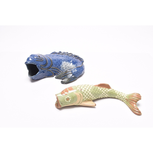 37 - Two Barnstaple art pottery wall pockets in the form of fish, late 19th century, comprising Alexander... 