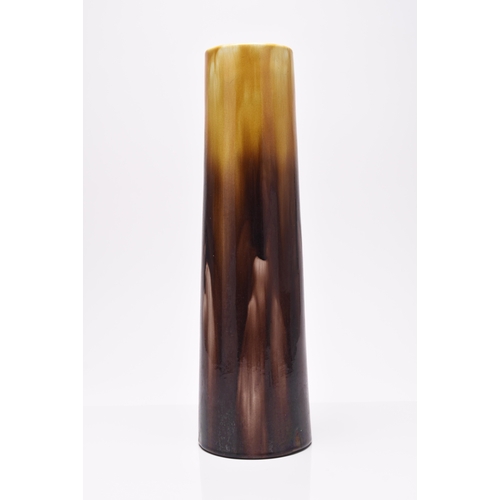 43 - A tall Ault pottery Art Nouveau vase, streaky treacle and darker brown glaze, of slightly flared cyl... 