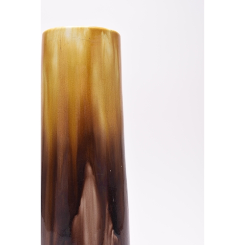 43 - A tall Ault pottery Art Nouveau vase, streaky treacle and darker brown glaze, of slightly flared cyl... 