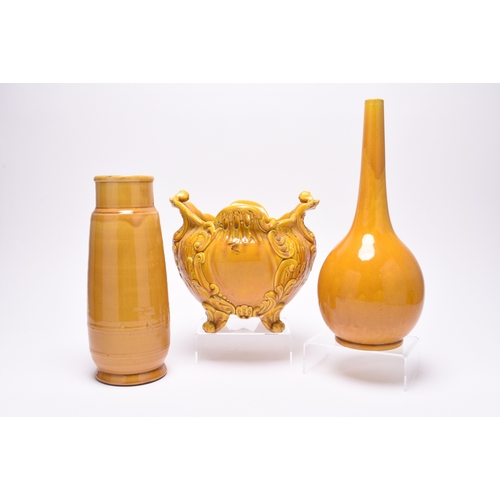 44 - A small group of bright yellow or mustard English art pottery, late 19th century, comprising a small... 