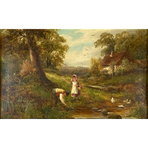 445 - Thomas Stevens (19th - 20th Century) A mother and children outside a country cottage, signed lower l... 