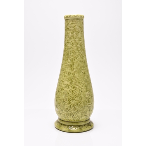 46 - A Burmantofts faience vase with a lime green glaze, shape 1400, with textured decoration, impressed ... 