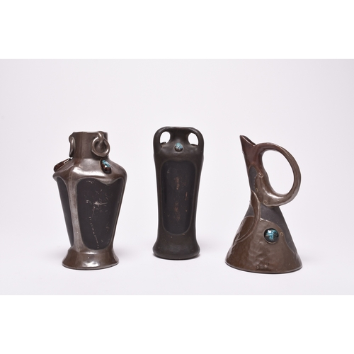 47 - A collection of seven Bretby Art Nouveau Pottery vases, circa 1900, of bronzed organic form decorate... 