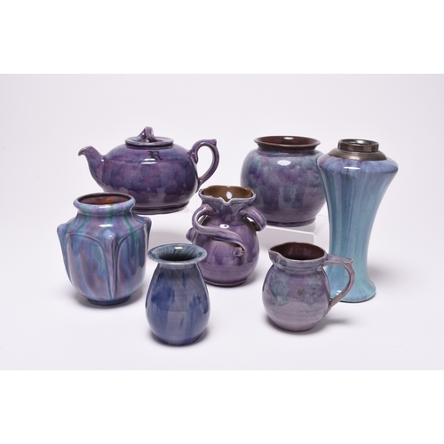 49 - A group of British art pottery, circa 1900-1918, century, purple glazes, principally William Baron o... 