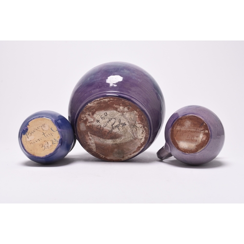 49 - A group of British art pottery, circa 1900-1918, century, purple glazes, principally William Baron o... 