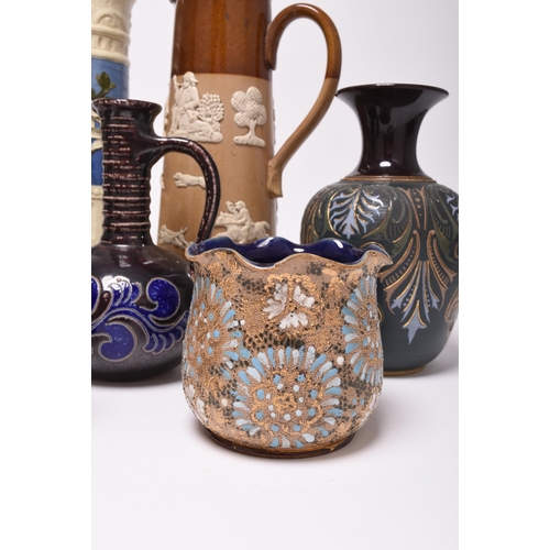 54 - A collection of British pottery, late 19th and early 20th century, principally stoneware, including ... 