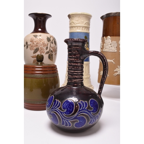 54 - A collection of British pottery, late 19th and early 20th century, principally stoneware, including ... 