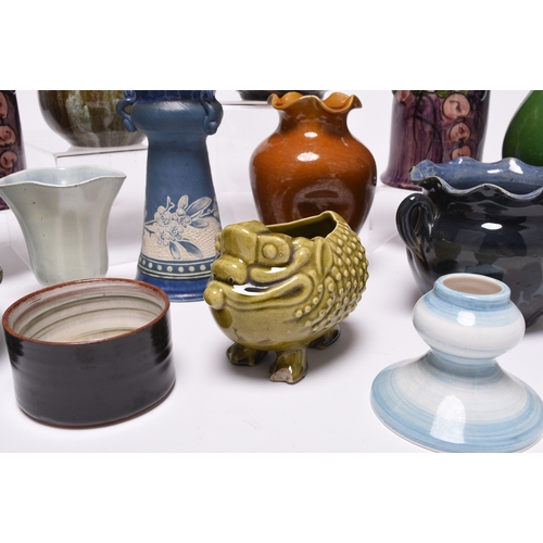 59 - A collection of British art pottery, circa 1880-1930, including a group of C H Brannam (Barnstaple):... 