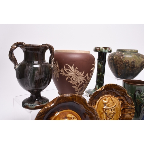 59 - A collection of British art pottery, circa 1880-1930, including a group of C H Brannam (Barnstaple):... 