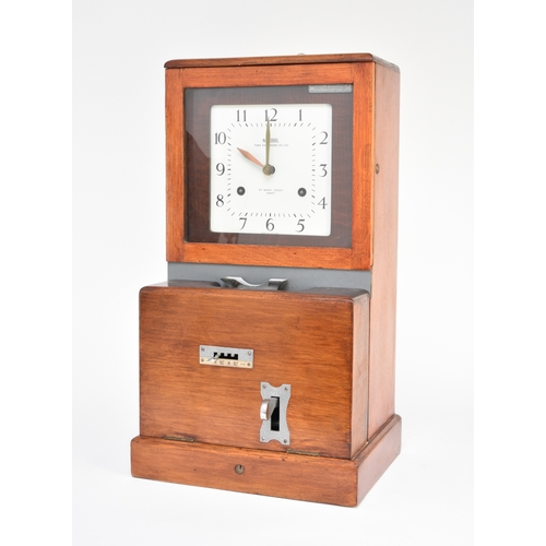 597 - A National Time Recorder Co, factory clock First half 20th century, stained beech case, the 8.25 inc... 