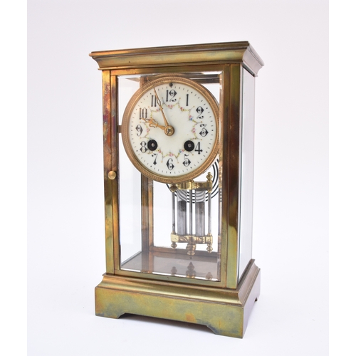 600 - A French brass four-glass mantel clock, circa 1900 The 3.5 inch enamel dial with Arabic chapter and ... 