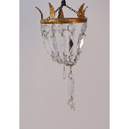 614 - Three Empire style chandeliers With gilt metal suspension rings hung with faceted bead baskets. Two ... 