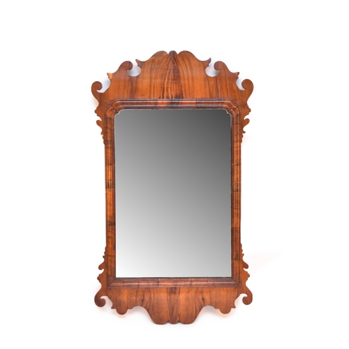 615 - An 18th century walnut fret type wall mirror 81cm high x 47cm wide (mirror plate 50cm x 34cm)