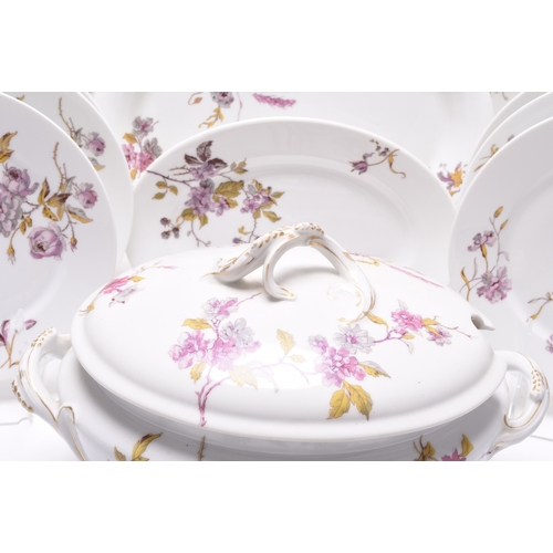 81 - A Limoges dinner service, circa 1888-1896, transfer-printed with an attractive predominantly pink fl... 