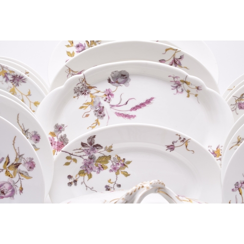 81 - A Limoges dinner service, circa 1888-1896, transfer-printed with an attractive predominantly pink fl... 