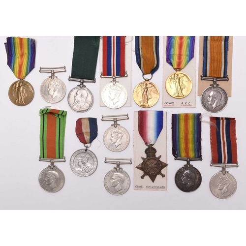 137 - A group of assorted medals, comprising three 1939-45 War Medals, two Defence Medals, a WW1 pair of 1... 