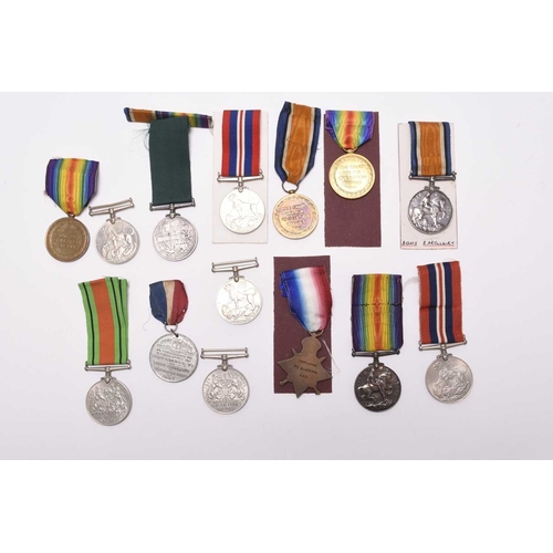 137 - A group of assorted medals, comprising three 1939-45 War Medals, two Defence Medals, a WW1 pair of 1... 