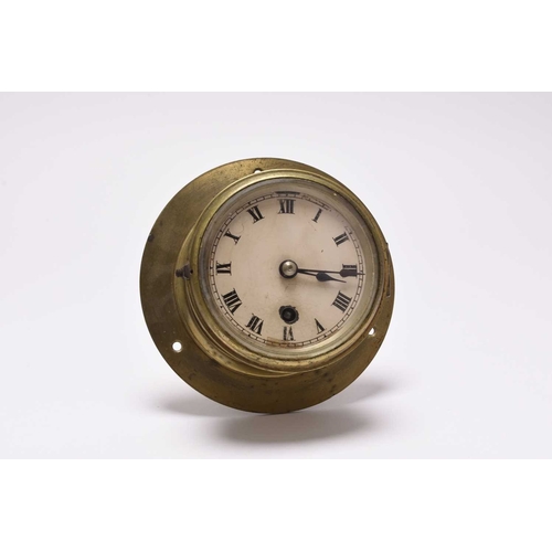 21 - A naval brass bulkhead timepiece, dated 1941, made by Elliott Ltd, Croydon, marked with Crown over G... 