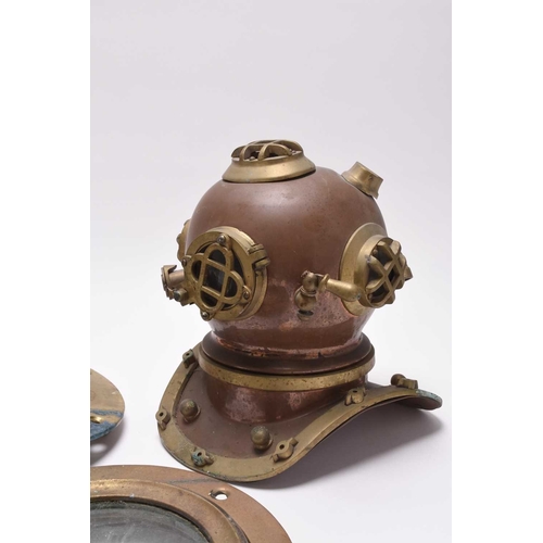 37 - A reproduction small deep sea US Navy diving helmet, 25cm high; and two porthole windows, 23cm diame... 