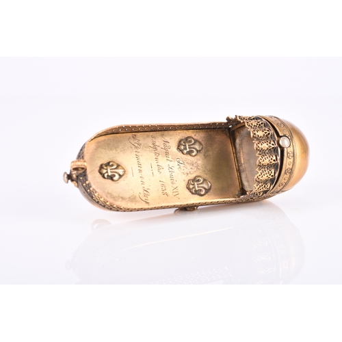 144 - A French gilt brass novelty snuff box, circa 1838 Modelled as the crib of King Louis XIV and inscrib... 