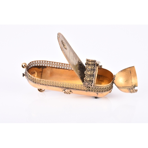 144 - A French gilt brass novelty snuff box, circa 1838 Modelled as the crib of King Louis XIV and inscrib... 