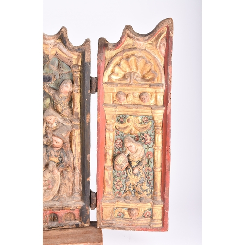 145 - A 17th century polychrome and parcel gilt gesso and carved wood triptych Portuguese or Spanish The c... 