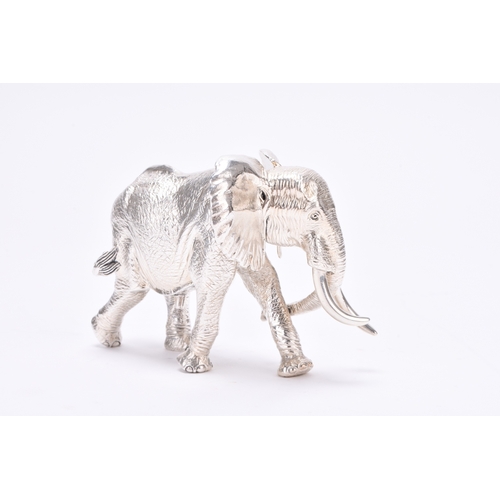 15 - A Patrick Mavros silver model of an elephant, the JOAO sculpture stamped 'PM', 10.5cm long, 7cm high... 