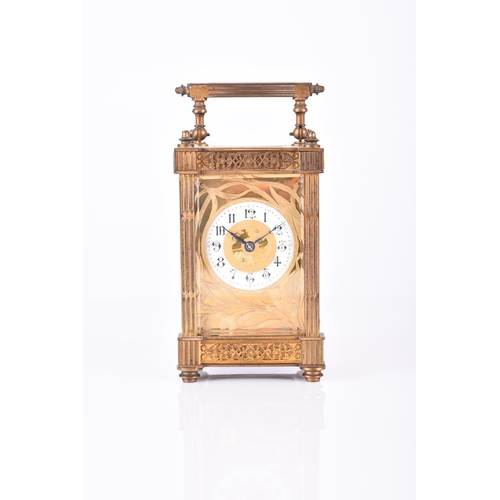 156 - A French early 20th century brass carriage clock The circular enamel dial with Arabic hours within a... 