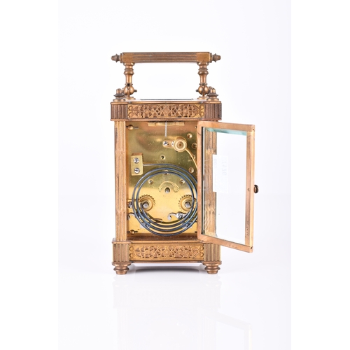 156 - A French early 20th century brass carriage clock The circular enamel dial with Arabic hours within a... 