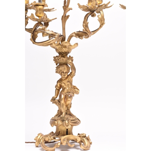 158 - A pair of ormolu rococo revival figural candelabra table lights 19th/20th century, the six branches ... 