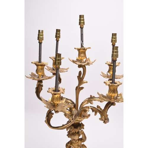 158 - A pair of ormolu rococo revival figural candelabra table lights 19th/20th century, the six branches ... 