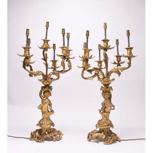 158 - A pair of ormolu rococo revival figural candelabra table lights 19th/20th century, the six branches ... 