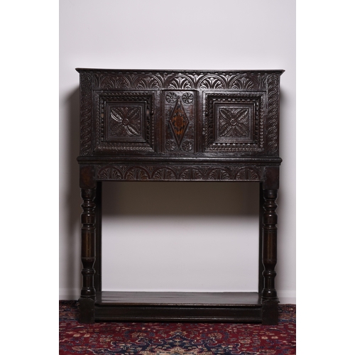 167 - A good Charles I oak livery cupboard Probably West Country, the moulded top with narrow dentil corni... 