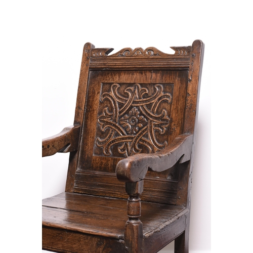 168 - A mid 17th century oak 'wainscot' armchair, Lake District Possibly Westmorland, with scroll and chan... 