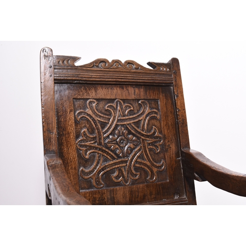 168 - A mid 17th century oak 'wainscot' armchair, Lake District Possibly Westmorland, with scroll and chan... 