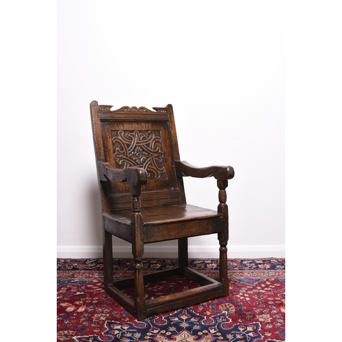 168 - A mid 17th century oak 'wainscot' armchair, Lake District Possibly Westmorland, with scroll and chan... 