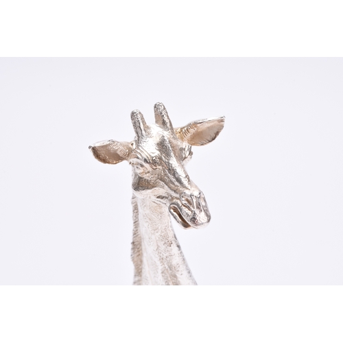 17 - A Patrick Mavros silver model of a giraffe, the sculpture modelled as a Giraffe sitting, stamped 'PM... 